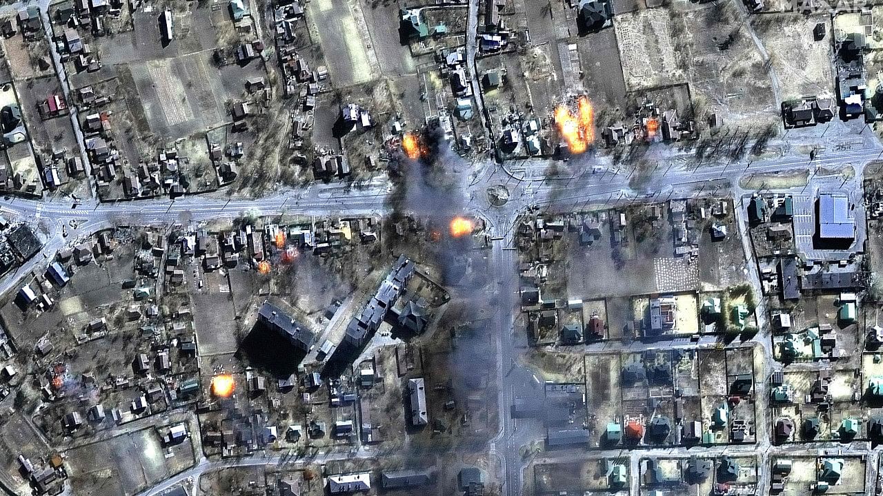 This Maxar satellite image shows a multispectral image view of burning homes in a residential area of Chernihiv, Ukraine. Credit: AFP Photo/Satellite image ©2022 Maxar Technologies