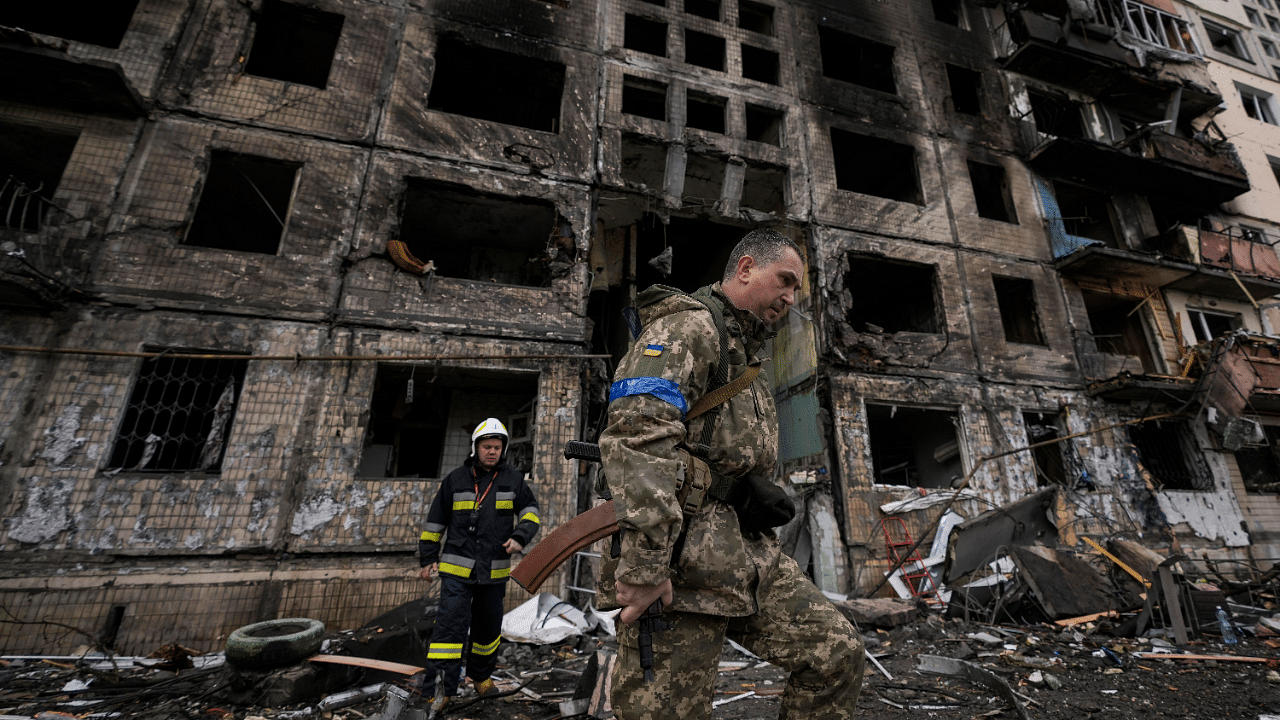 Ukrainian soldiers and firefighters search in a destroyed building after a bombing attack in Kyiv, Ukraine. Credit: AP Photo