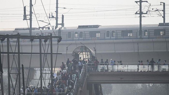 A large number of office-goers avail themselves of Metro services at this time to travel to their destinations in Delhi and neighbouring cities. Credit: AFP File Photo