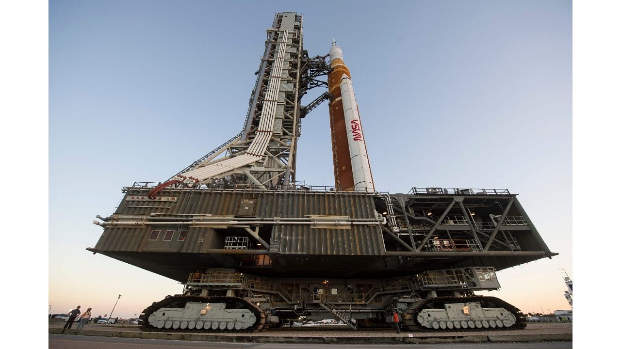 In this NASA handout photo NASA's Space Launch System (SLS) rocket with the Orion spacecraft aboard is seen atop a mobile launcher as it rolls out to Launch Complex 39B for the first time, March 17, 2022, at NASA's Kennedy Space Center in Florida. Credit: AFP Photo