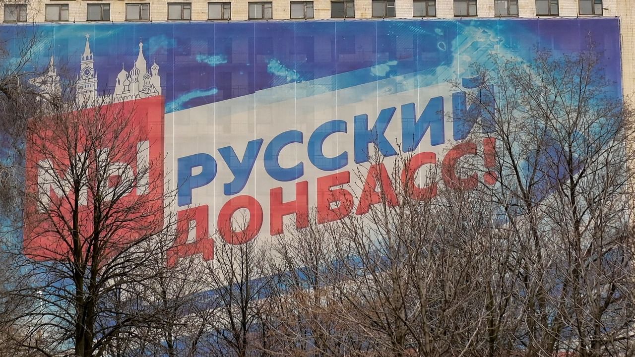 A huge banner displaying the slogan "We are Russian Donbass!" covers a building in the rebel held city of Donetsk. Credit: AFP file photo