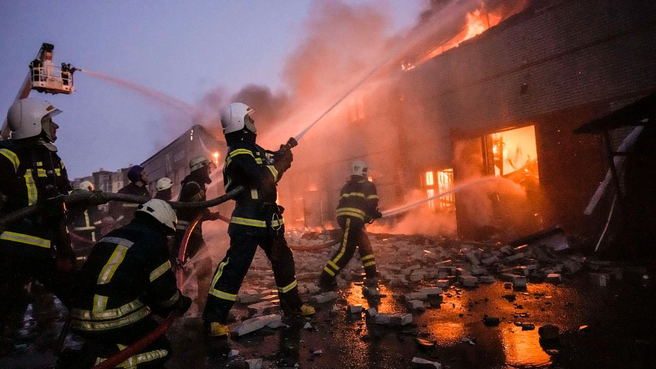 Ukrainian firefighters extinguish a blaze at a warehouse after a bombing in Kyiv. Credit: Reuters photo