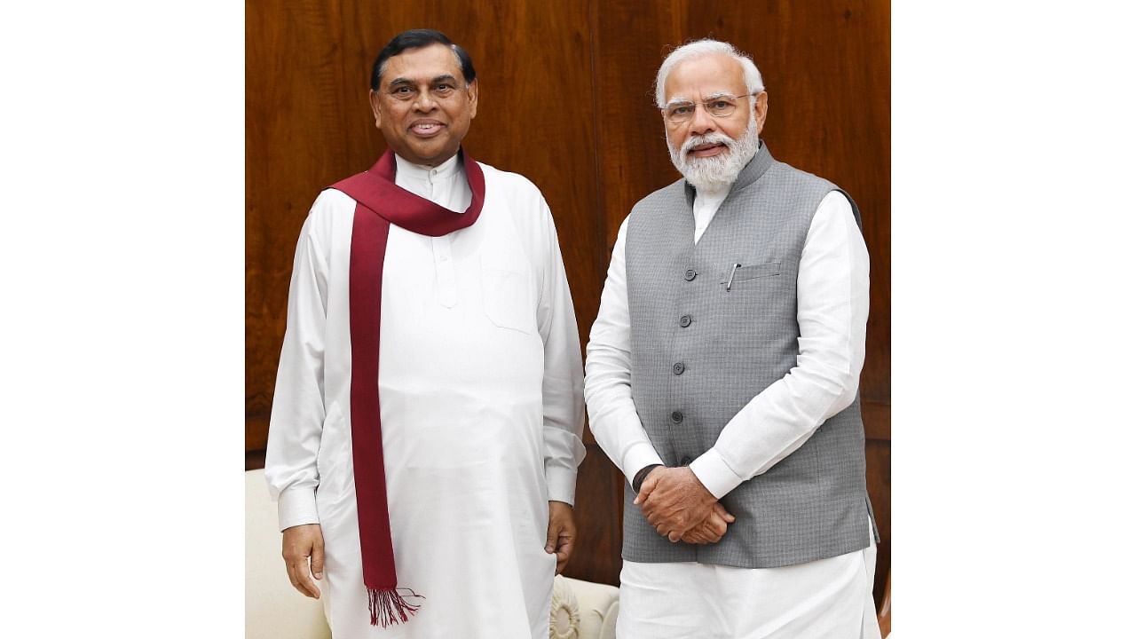  New Delhi: Prime Minister Narendra Modi with Sri Lankan Finance Minister Basil Rajapaksa. CreditL PTI Photo