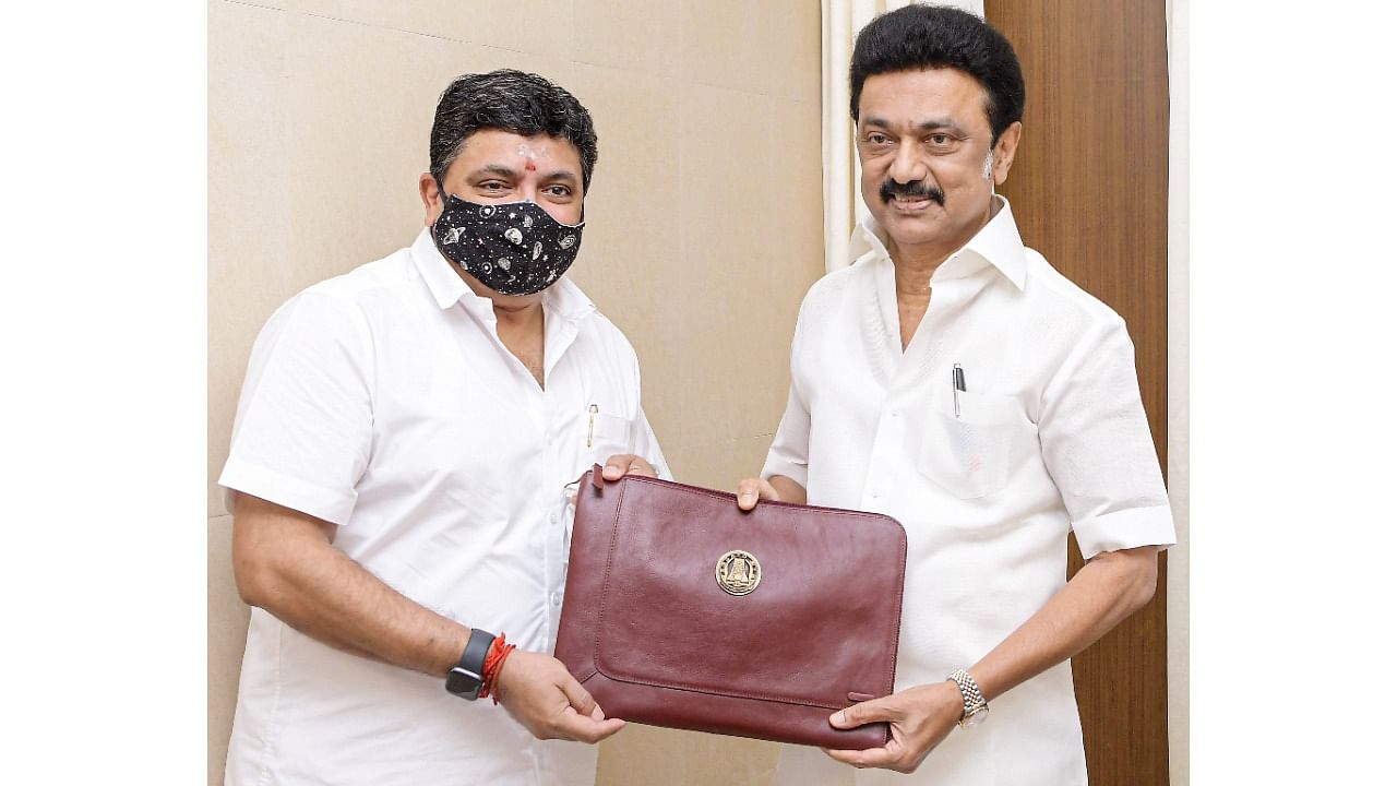 Tamil Nadu Chief Minister M K Stalin and Finance Minister PTR Palanivel Thiagarajan hold a bag containing the state budget 2022-23, before the budget session in the assembly, at Fort St George, in Chennai, Friday, March 18, 2022. Credit: PTI Photo