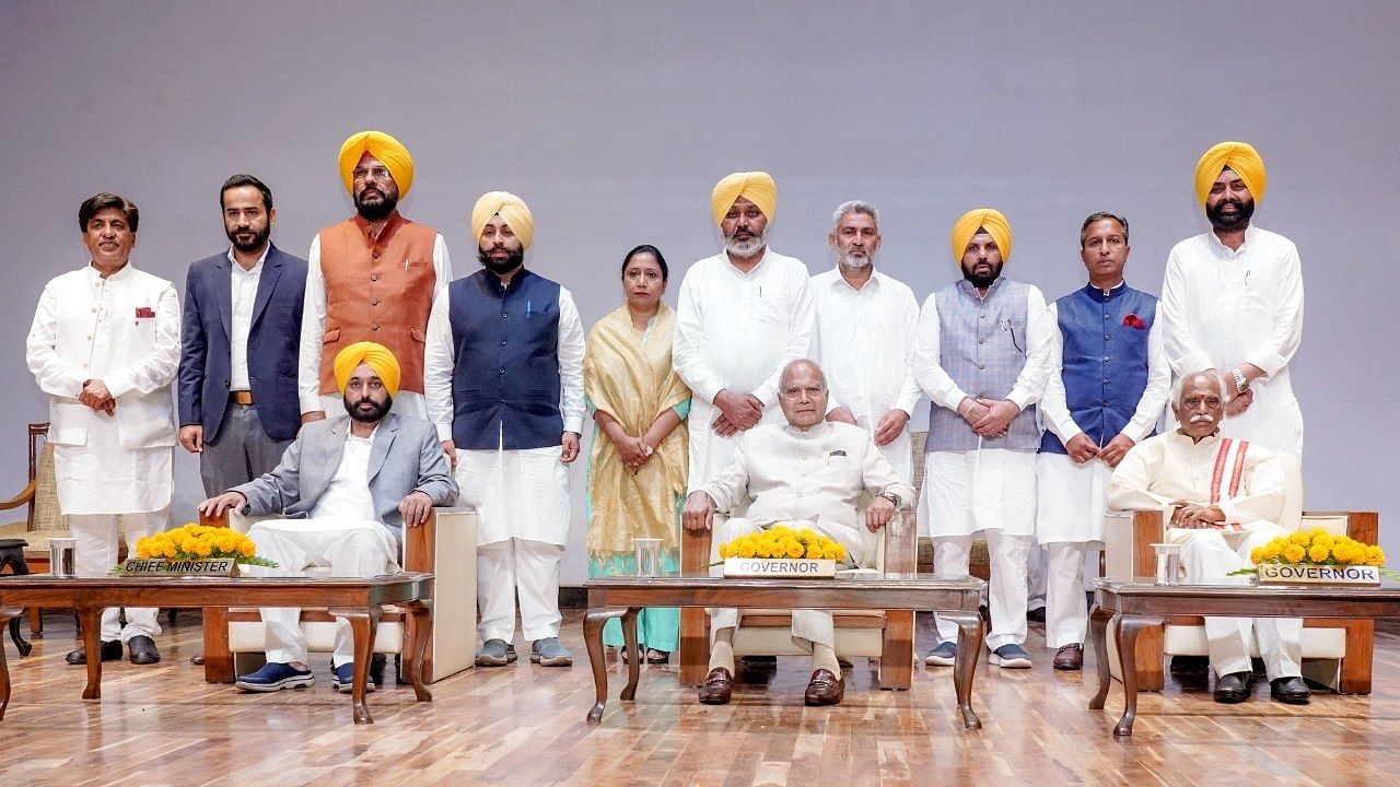 The Governor of Punjab Banwarilal Purohit on Saturday administered the oath of office and secrecy to the 10 newly inducted Cabinet Ministers in the presence of Chief Minister Bhagwant Mann. Credit: IANS Photo