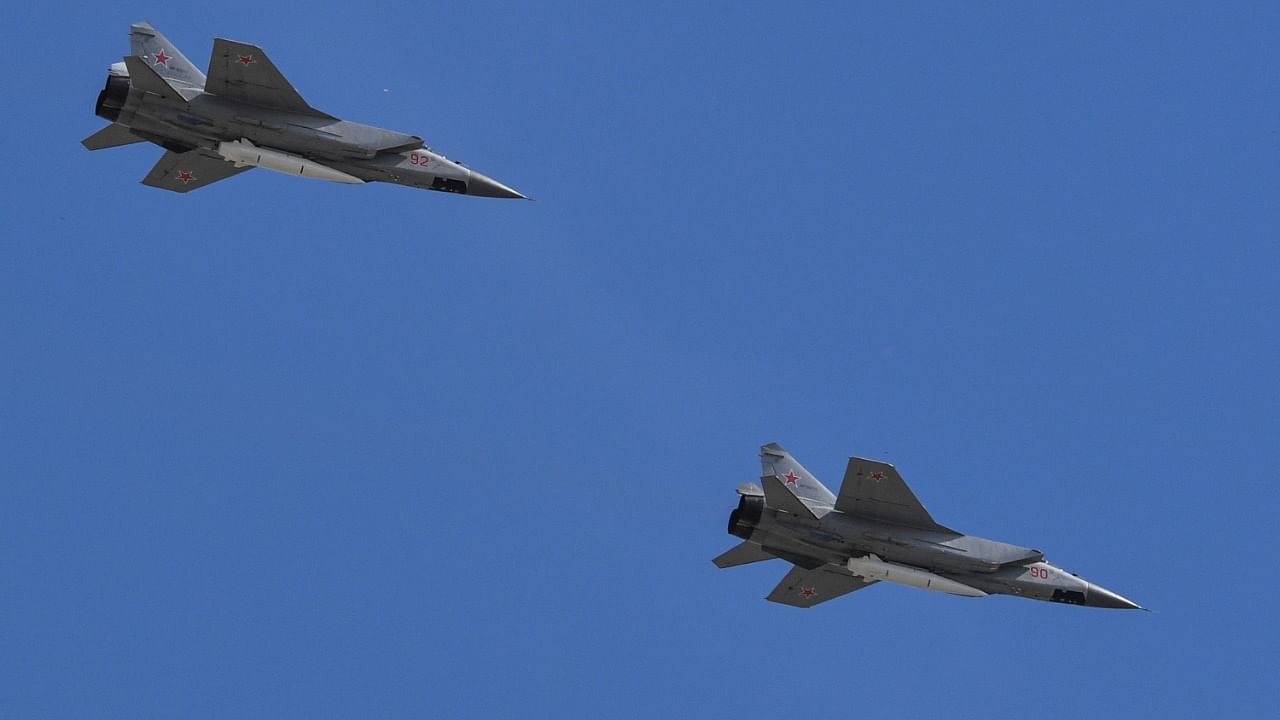 This file photo taken on May 9, 2018 shows Russia's MiG-31 supersonic interceptor jets carrying hypersonic Kinzhal (Dagger) missiles flying over Red Square during the Victory Day military parade in Moscow. Credit: AFP Photo