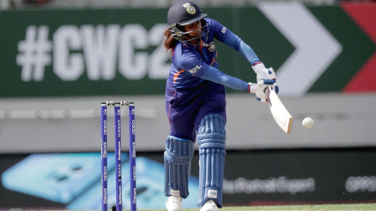 India’s captain Mithali Raj plays a shot to reach her half century during the 2022 Women's Cricket World Cup match between Australia and India at Eden Park in Auckland. Credit: AFP Photo