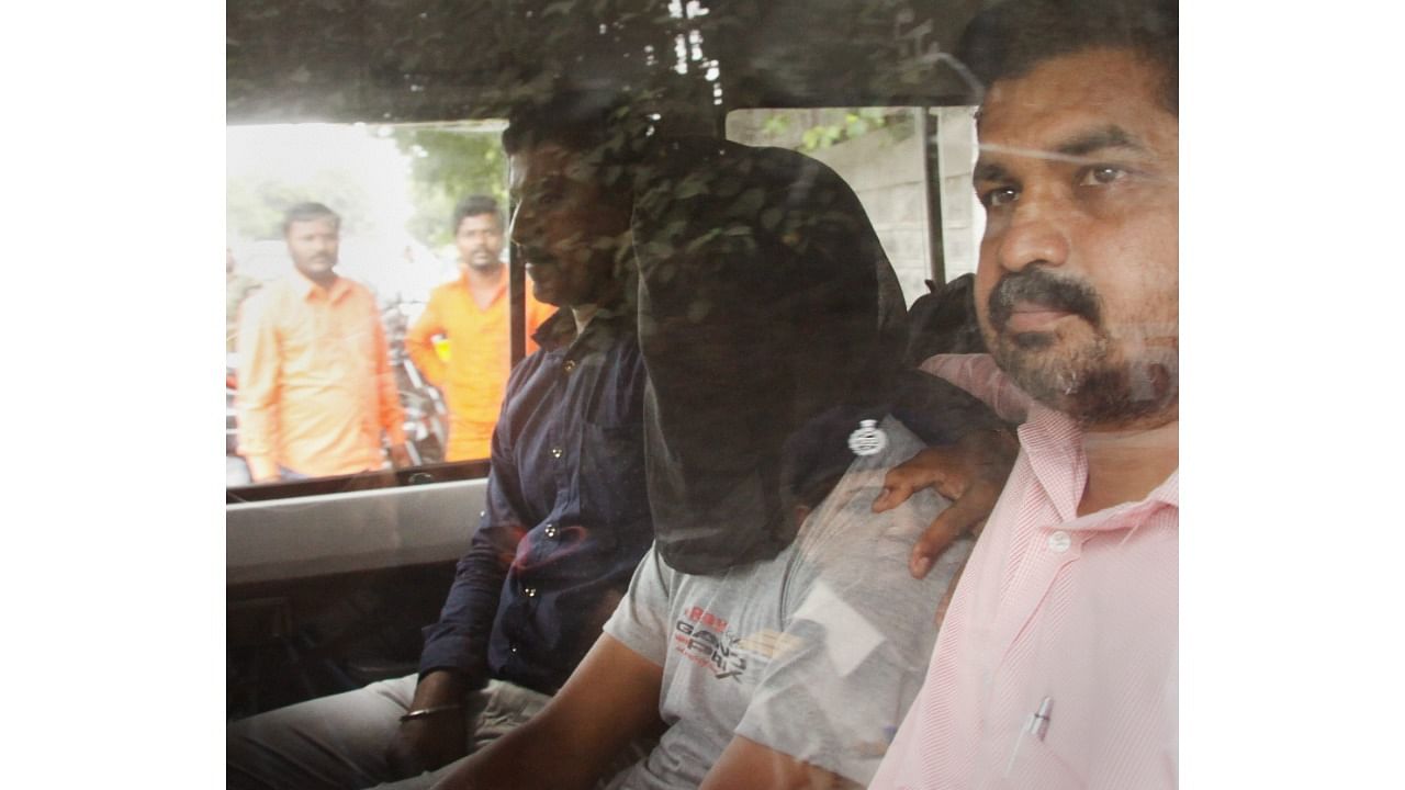 In this undated file photo, Sharad Kalaskar accussed in rationalist Narendra Dabholkar killing taken to Pune court. Credit: PTI Photo