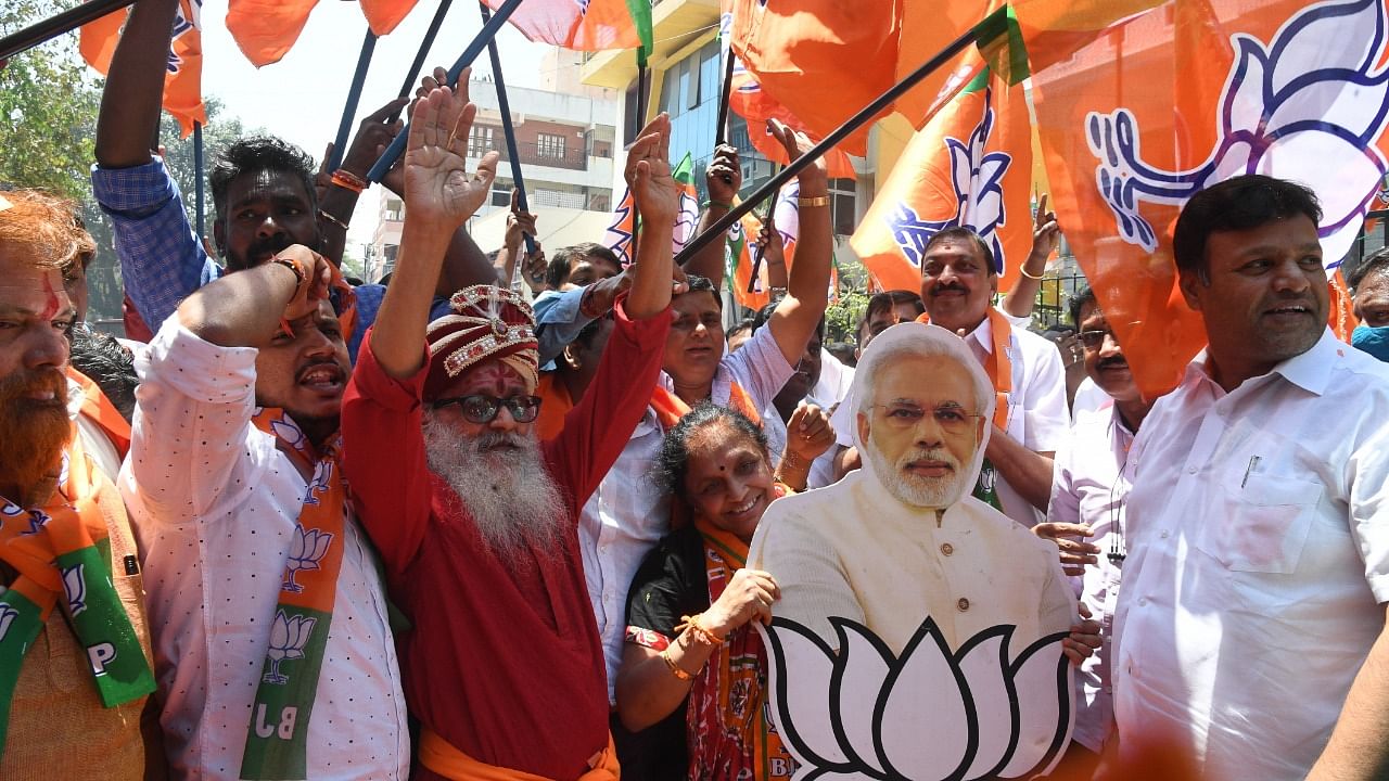 BJP supporters celebrate the part's poll victories in four states. Credit: DH Photo