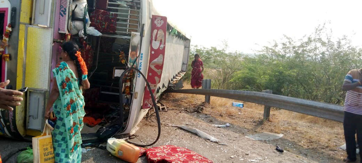 The private bus which toppled near Palavalli Katte in Pavagada taluk of Tumakuru district. Credit: DH Photo