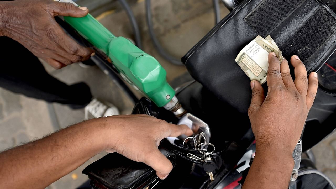 Petrol pump sales have jumped by a fifth this month after bulk users like bus fleet operators and malls queued up at petrol bunks. Credit: PTI Photo