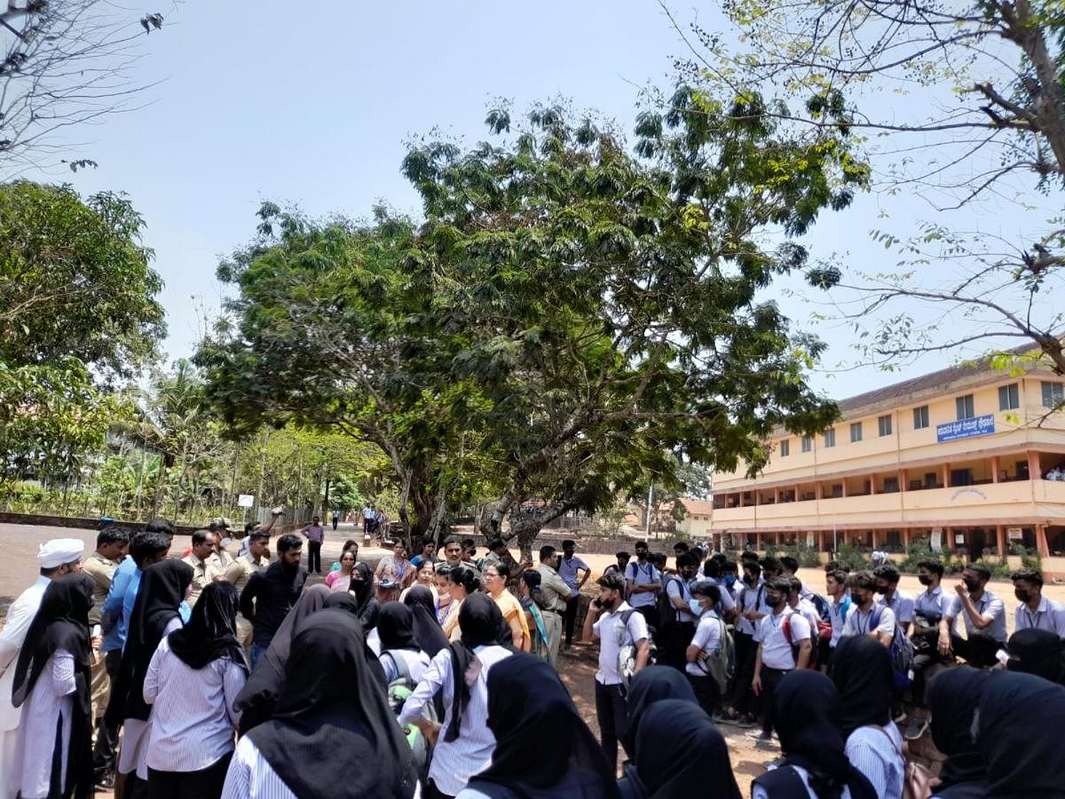 Students protest inside the campus after the principal of St Raymond’s Institution in Vamanjoor prevented them from writing examinations with the hijab on Monday. DH Photo/Irshad Mahammad