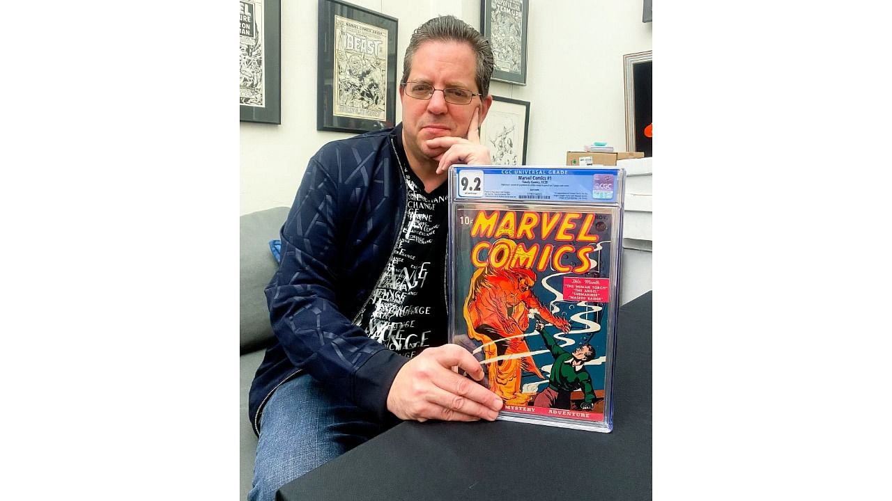 Stephen Fishler, the chief executive of ComicConnect, with a copy of Marvel Comics No. 1 from 1939. Credit: Michael Cohen/ComicConnect.com, via Associated Press