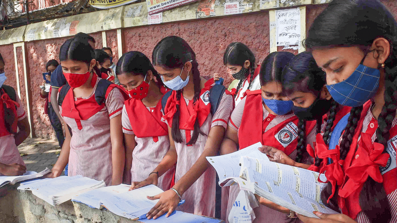 Students of Xth standard revise their syllabus before appearing for the first exam of the West Bengal Board of Secondary Education. Credit: PTI Photo