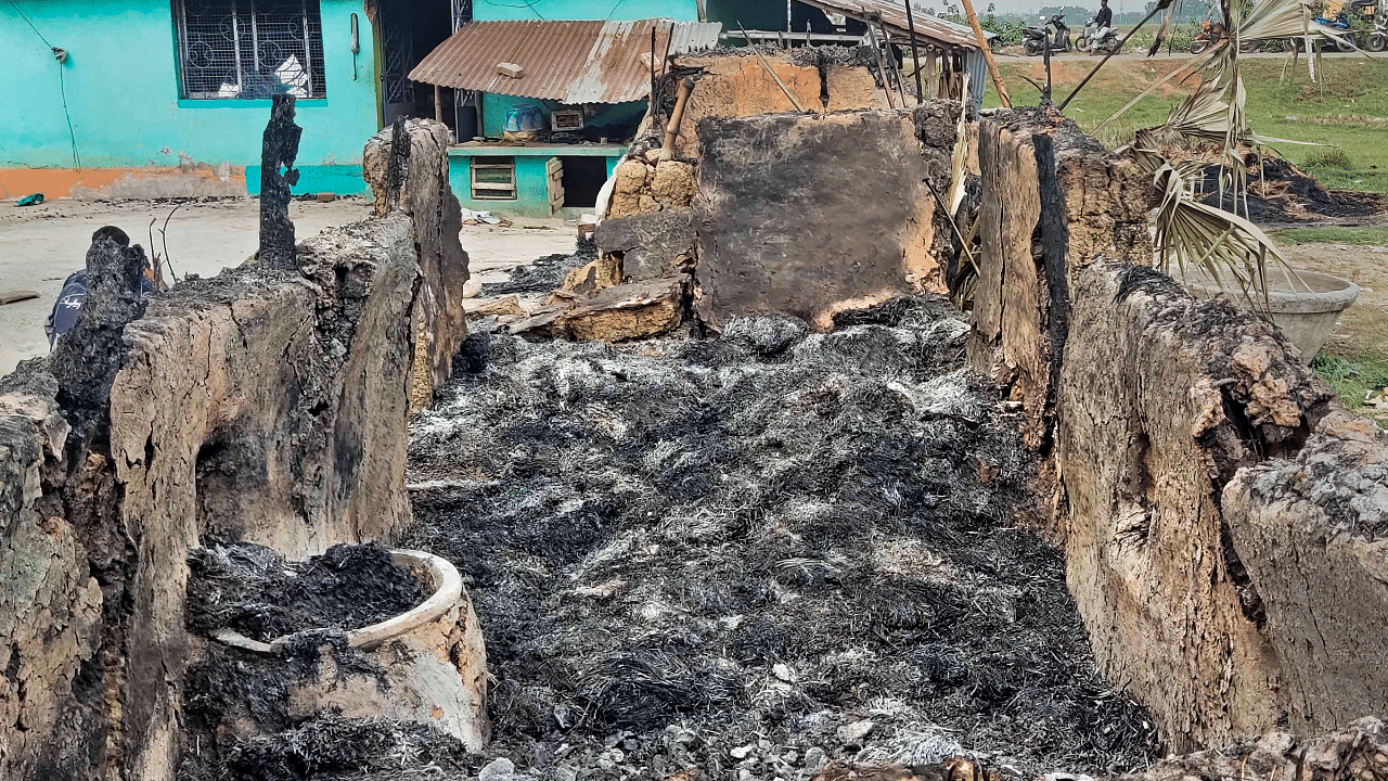 Charred remains of the houses after some miscreants set the houses on fire for allegedly avenging the killing of TMC leader Bhadu Sheikh. Credit: PTI Photo