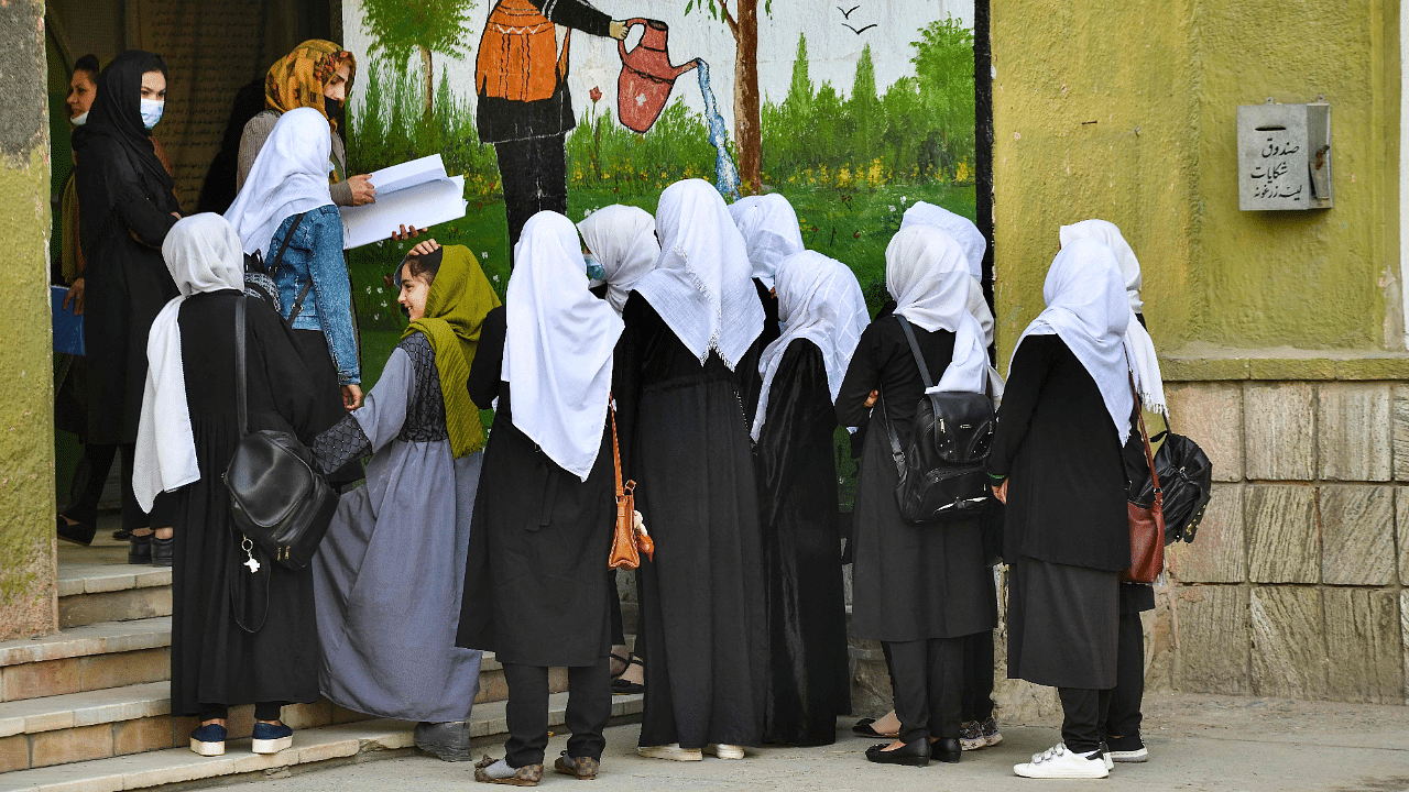 Girls arrive at their school in Kabul. Credit: AFP Photo