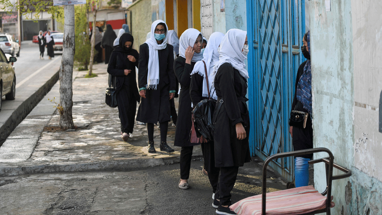 Girls arrive at their school in Kabul. Credit: AFP Photo