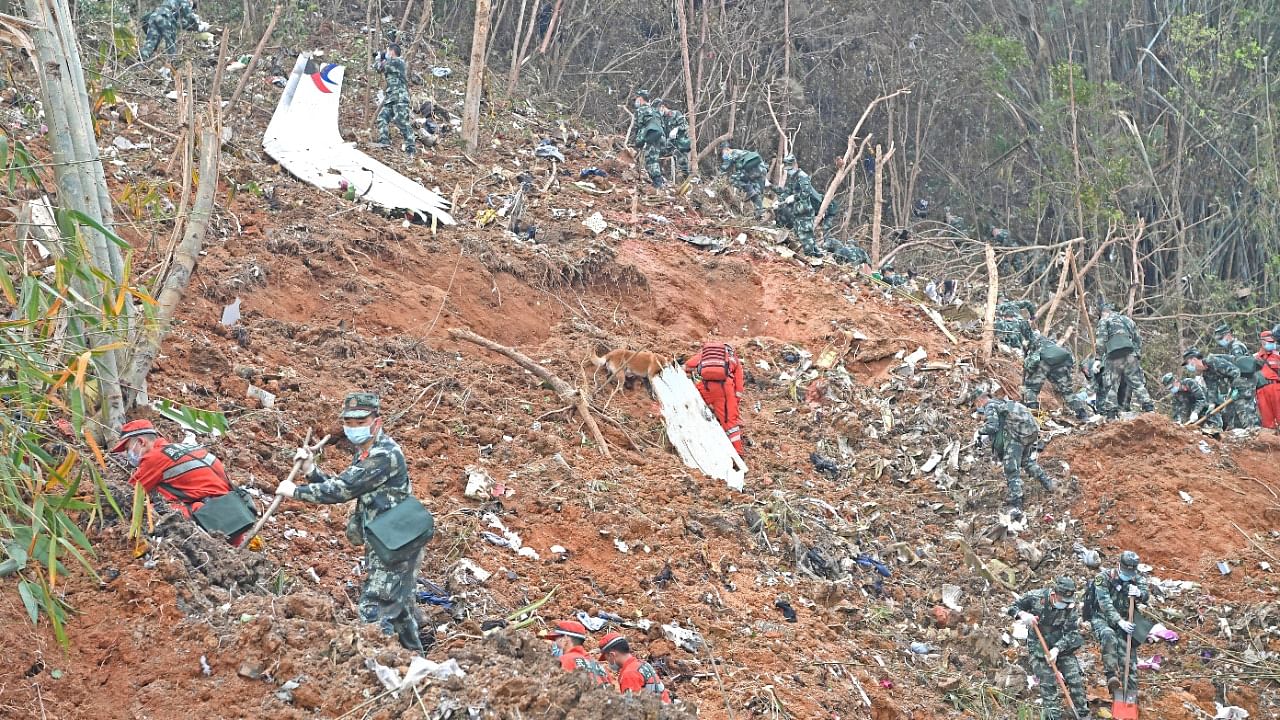 Rescuers search for the black boxes at a plane crash site in Tengxian county of Wuzhou, Guangxi Zhuang Autonomous Region, China. Credit: Reuters photo