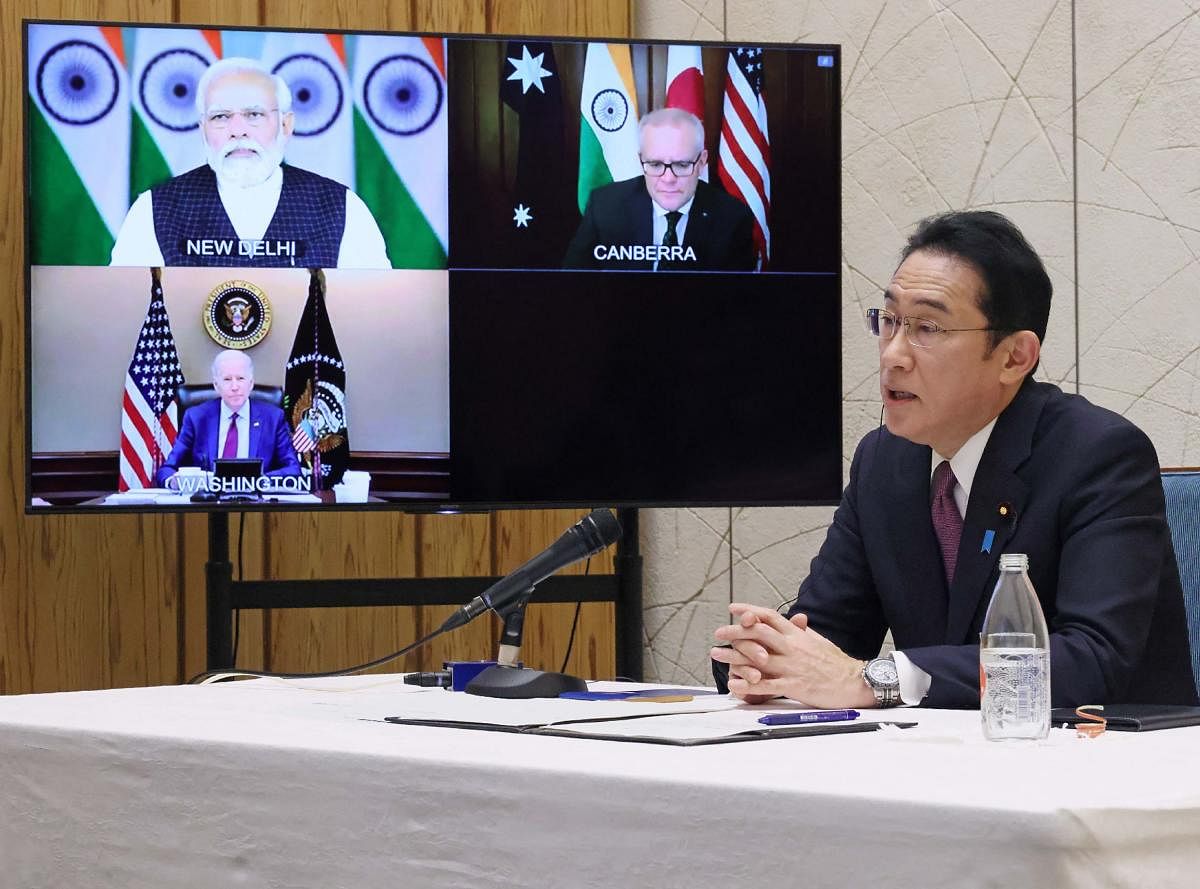 Japanese Prime Minister Fumio Kishida attending the Quadrilateral Security Dialogue (Quad) online meeting at prime minister's office in Tokyo, with (on screen) India's Prime Minister Narendra Modi, US president Joe Biden and Australia's Prime Minister Scott Morrison. Credit: AFP Photo/Japan's Cabinet Public Relations Office