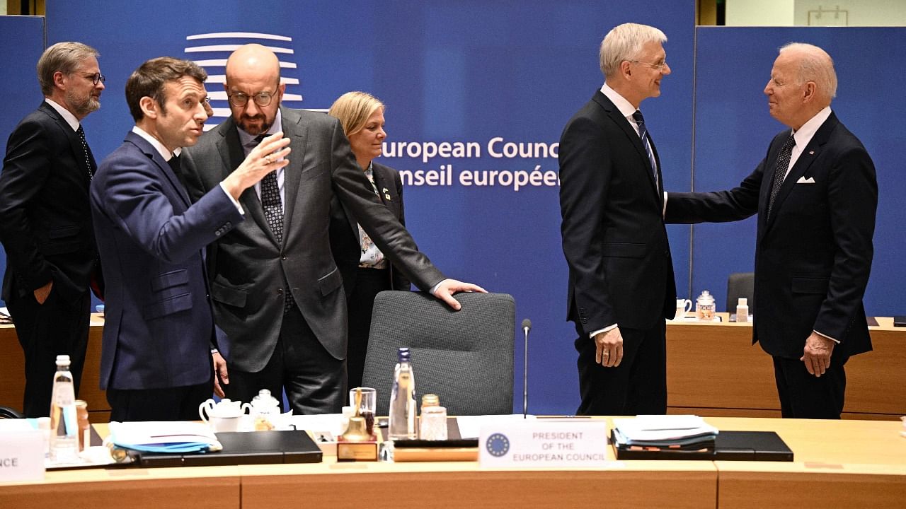 Heads of states interact ahead of a EU meeting. Credit: AFP Photo