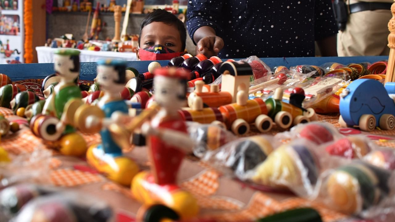 Channapatna toys in display at KSR Station. Credit: DH Photo