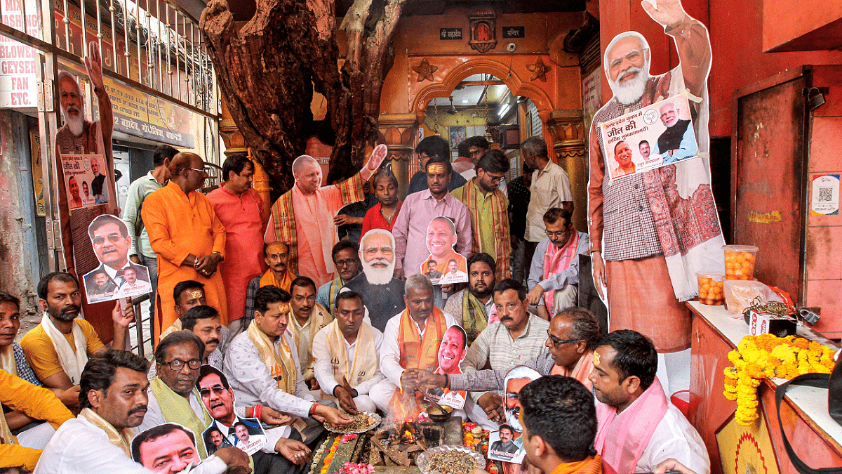 BJP workers perform a 'havan', before the oath-taking ceremony of UP CM-designate Yogi Adityanath. Credit: PTI Photo