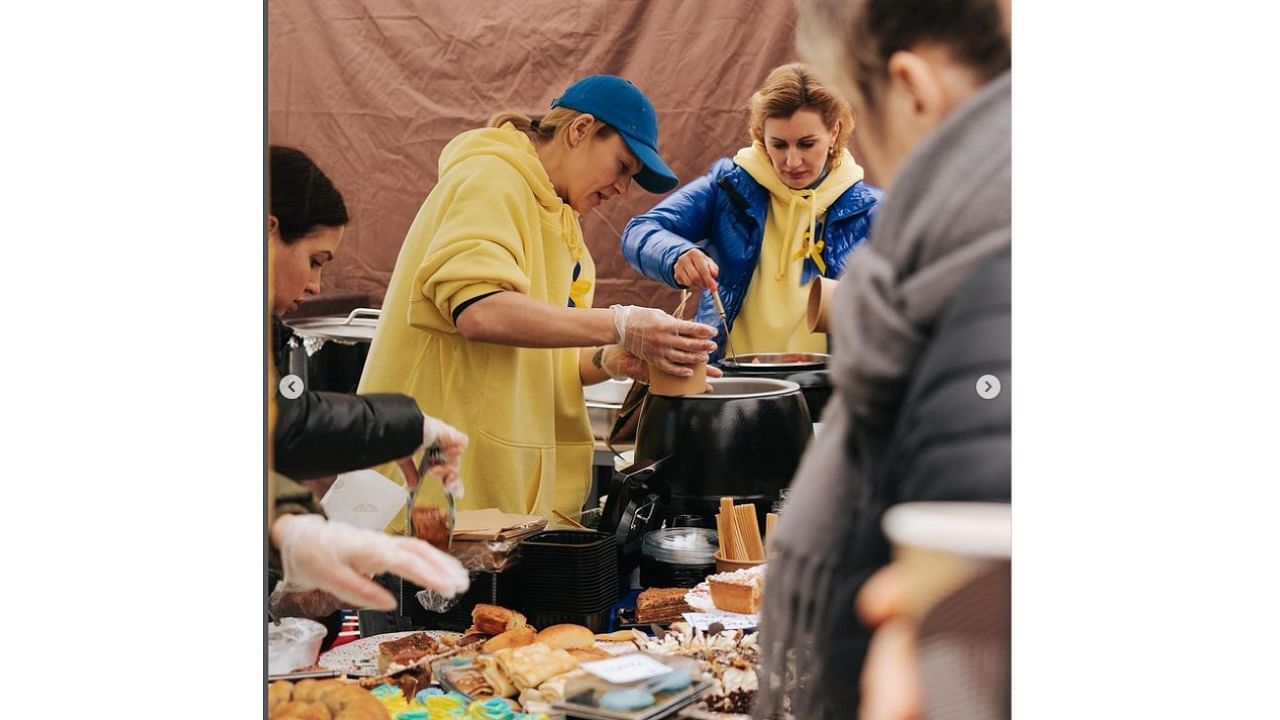 At a stand flying the Ukrainian flag at a popular farmer's market along the city's Vltava river, Martynovska and fellow refugees dished up delicacies including poppy seed cakes, pierogies and homemade sweets. Credit: Instagram/olga_martynovska