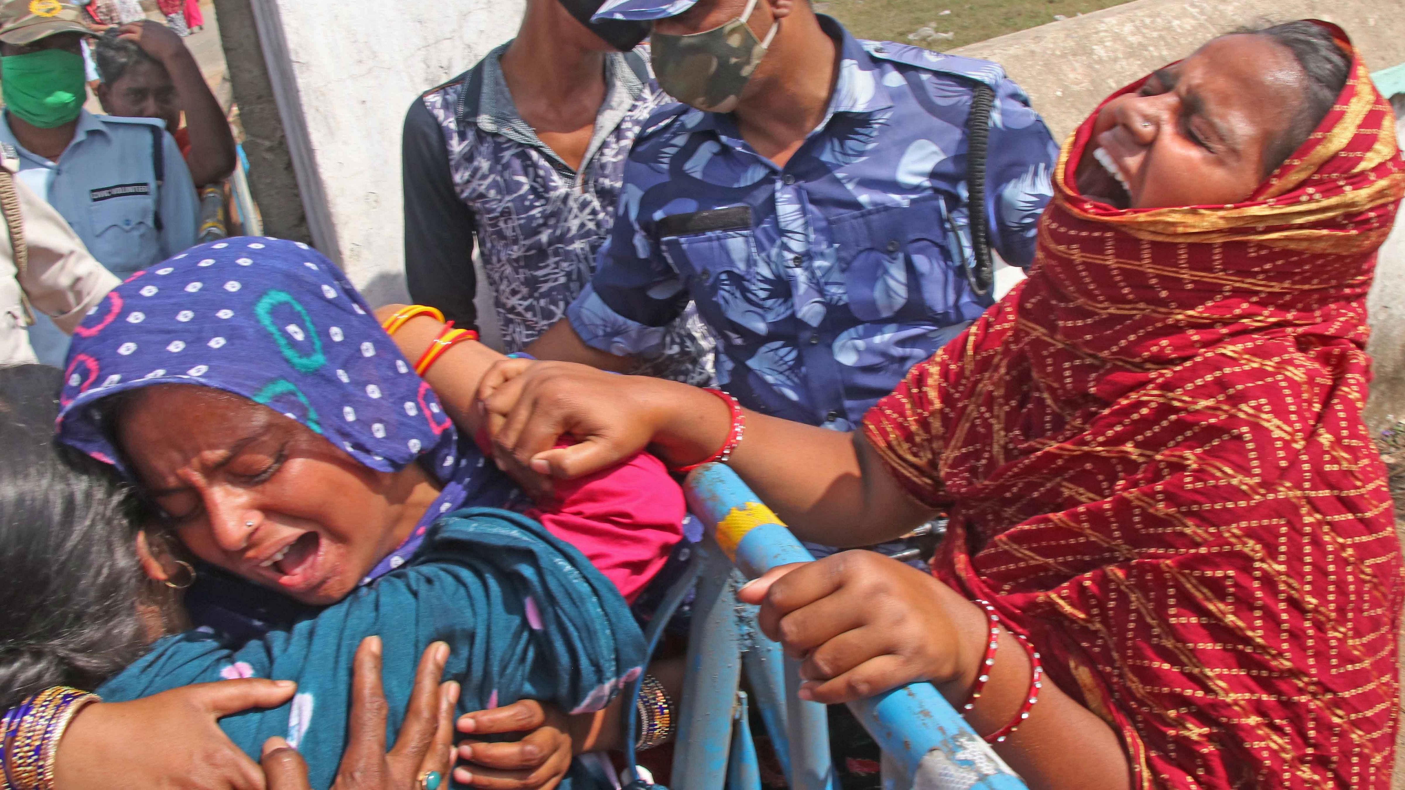  Family members of Sona Shaikh, after 8 people died in the violence that broke out at Bogtui village, in Birbhum district. Credit: PTI Photo