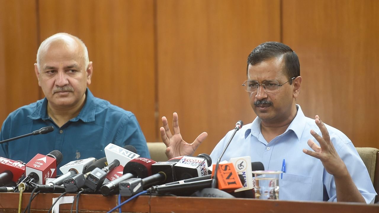 Delhi Chief Minister Arvind Kejriwal with Deputy Chief Minister Manish Sisodia addresses the media after tabling of the State Budget 2022-23 in the Vidhan Sabha. Credit: PTI Photo