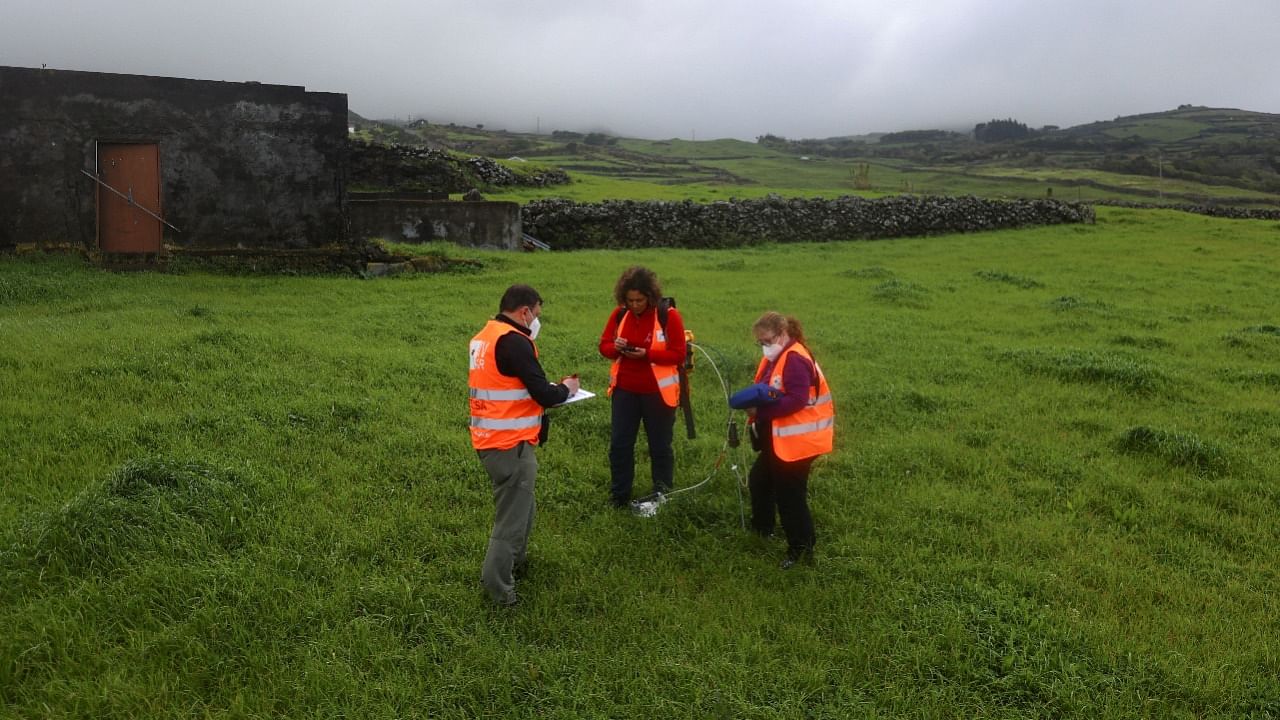 Vittoreo Zanon, Fatima Viveiros and Catarina Silva monitor soil gases in Rosais near Velas as small earthquakes have been recorded in Sao Jorge island, Azores, Portugal. Credit: Reuters Photo