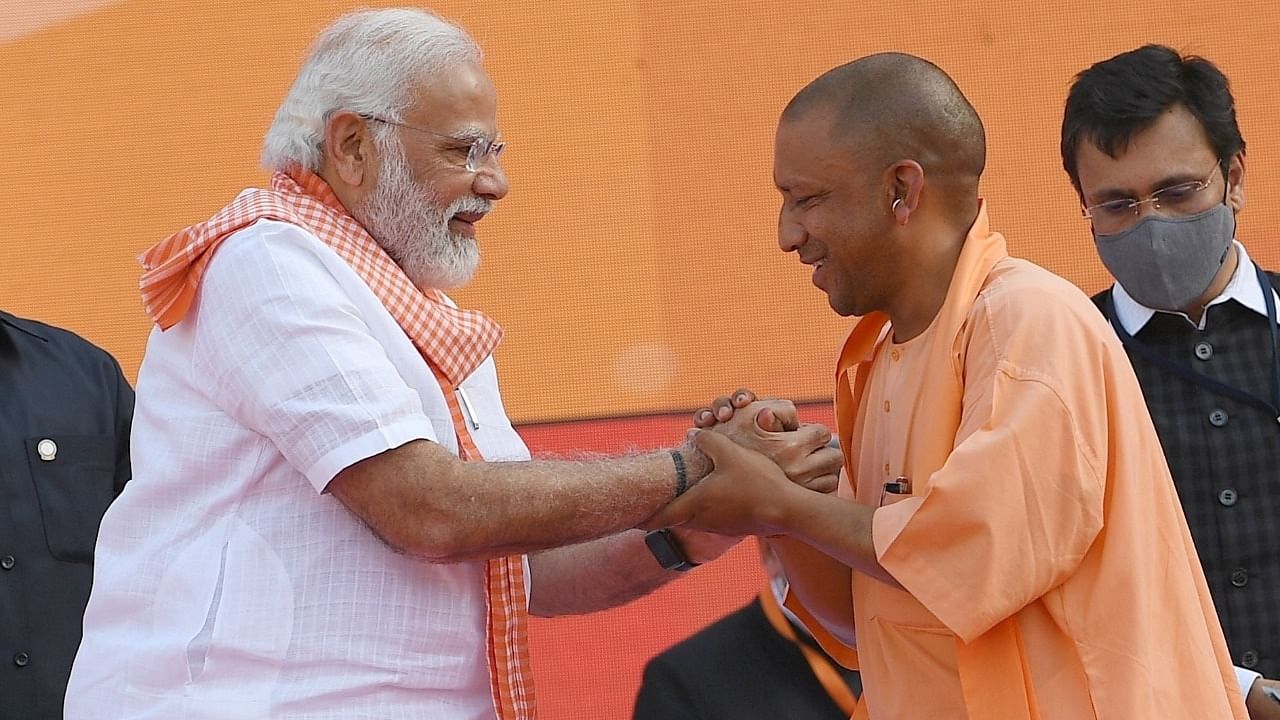 Prime Minister Narendra Modi with Uttar Pradesh CM Yogi Adityanath during an oath ceremony at Atal Bihari Ekana Stadium in Lucknow. Credit: IANS Photo