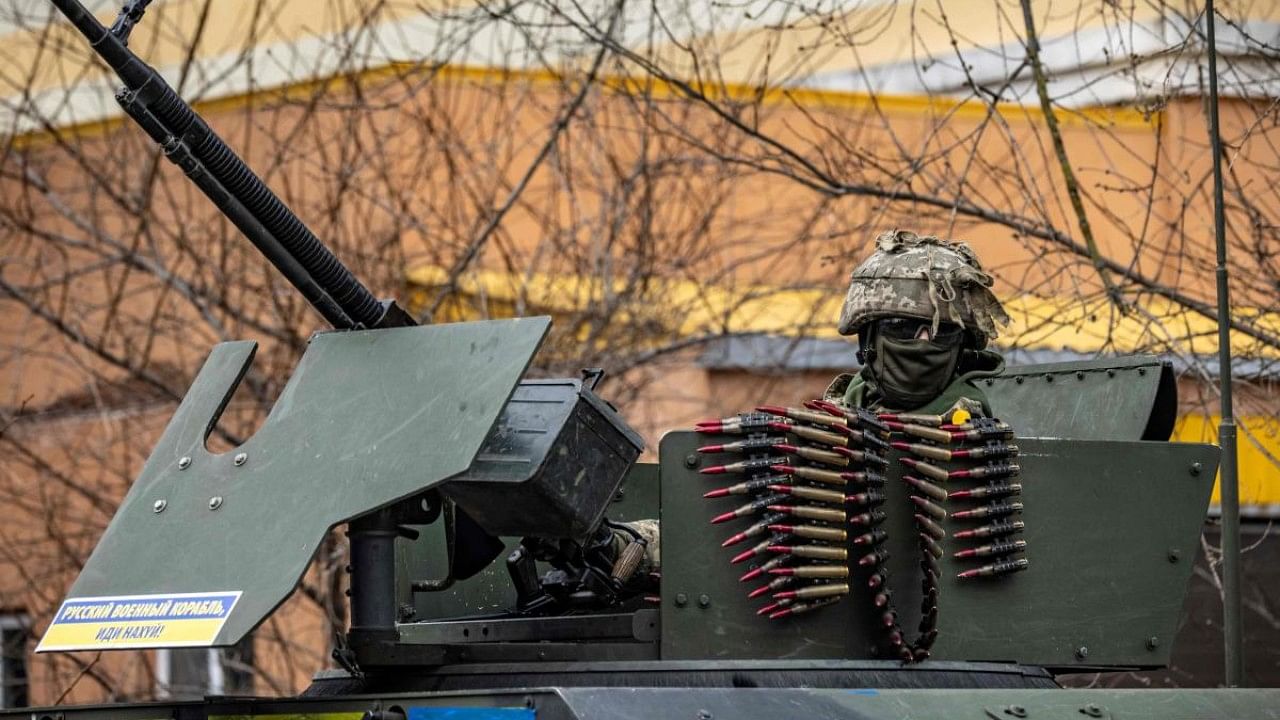  A Ukrainian soldier sits in an armored car in the suburbs of Kyiv. Credit: AFP Photo