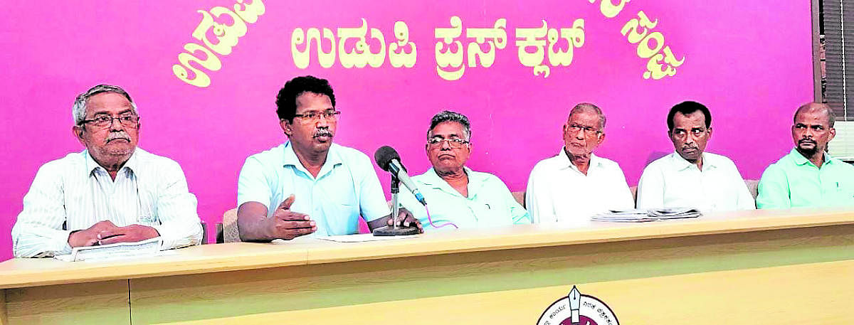 Joint committee of labour organisations convener K Shankar speaks to reporters in Udupi.