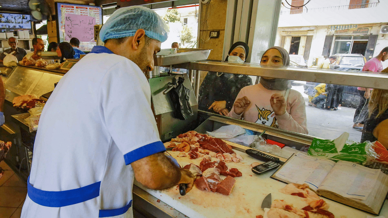 People waiting for their orders at a butcher in Lebanon's northern port city of Tripoli, as Muslims across the world are getting ready to celebrate Eid al-Adha. Credit: AFP Photo