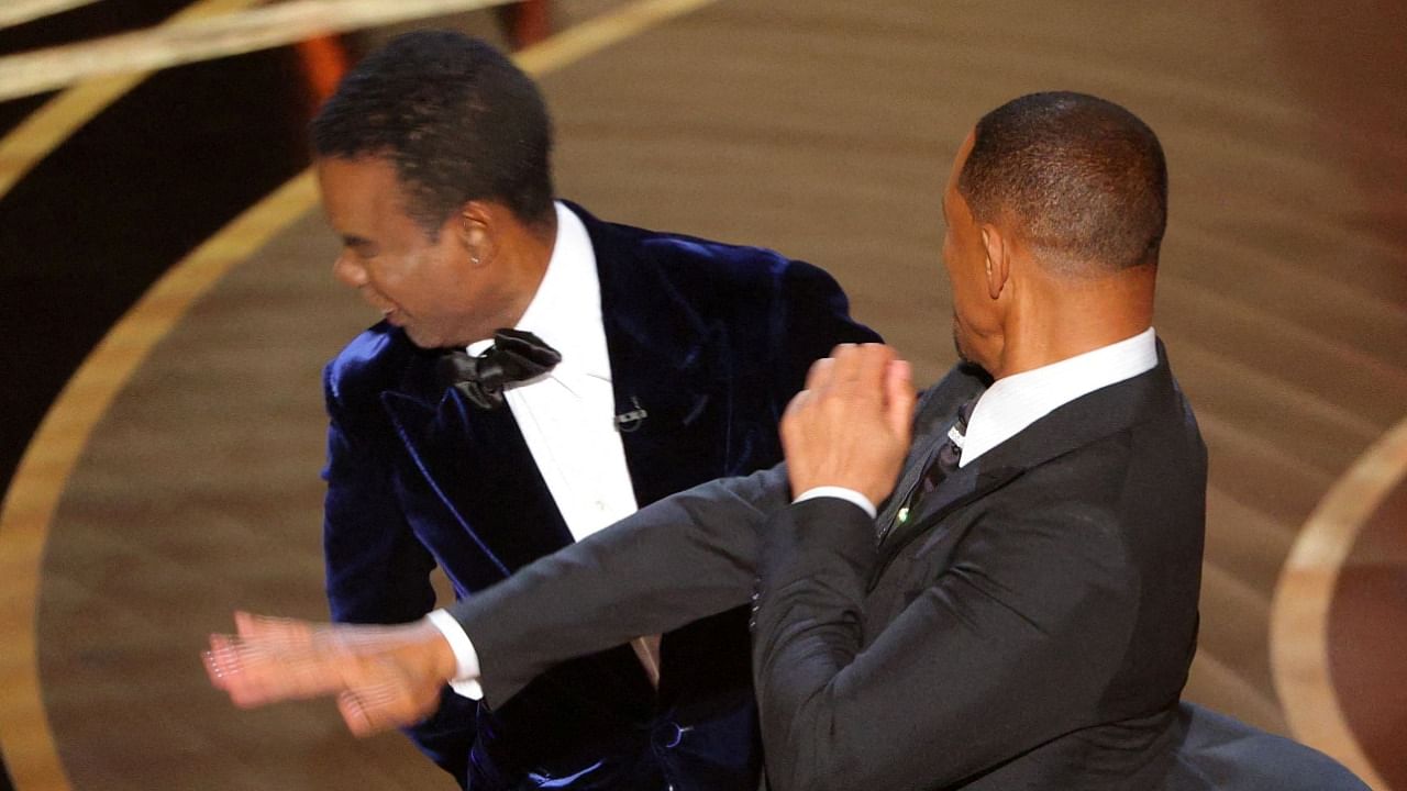 Will Smith hits at Chris Rock as Rock spoke on stage during the 94th Academy Awards. Credit: Reuters Photo