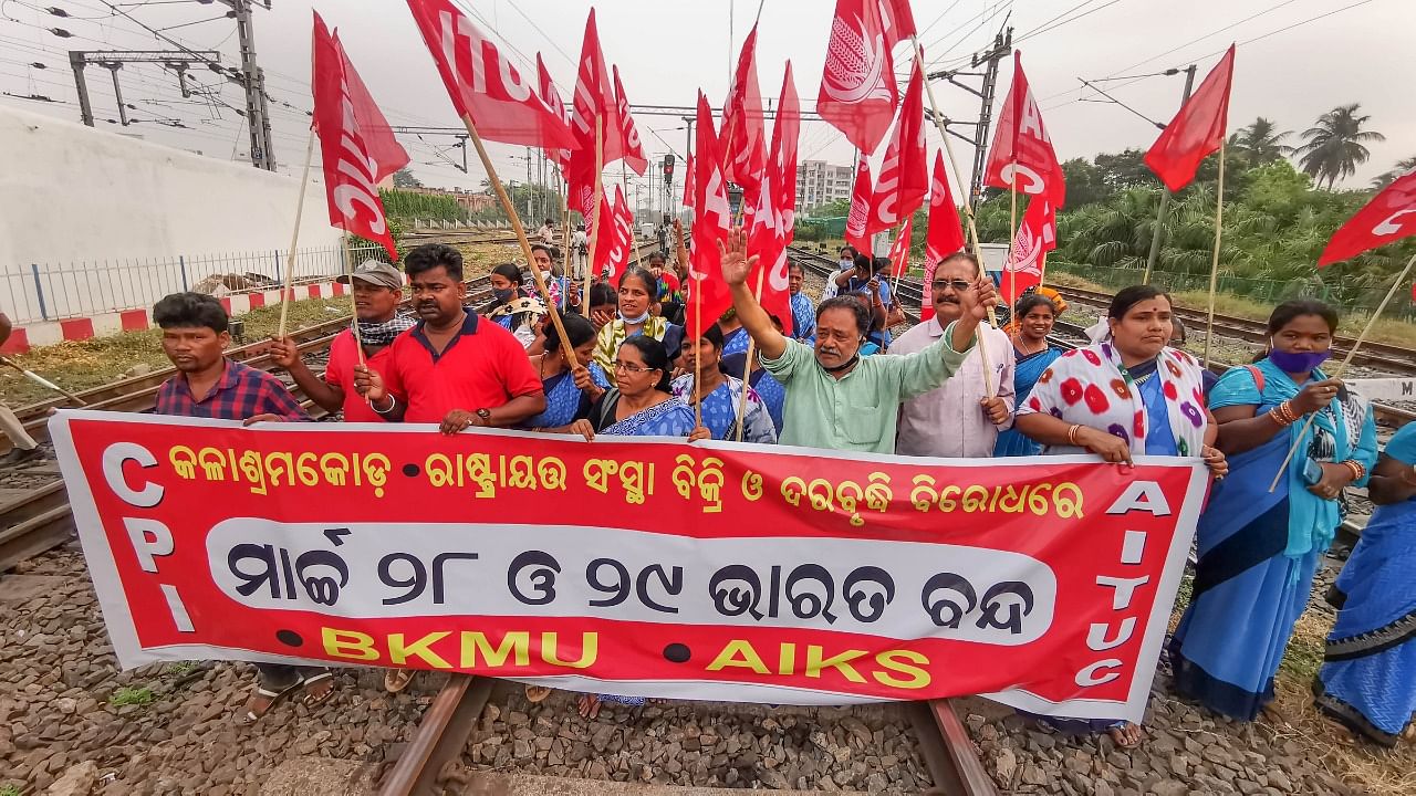 Left Front workers block railway tracks during a nationwide strike called by central trade unions to protest against Centre's policies, in Bhubaneswar. Credit: PTI Photo