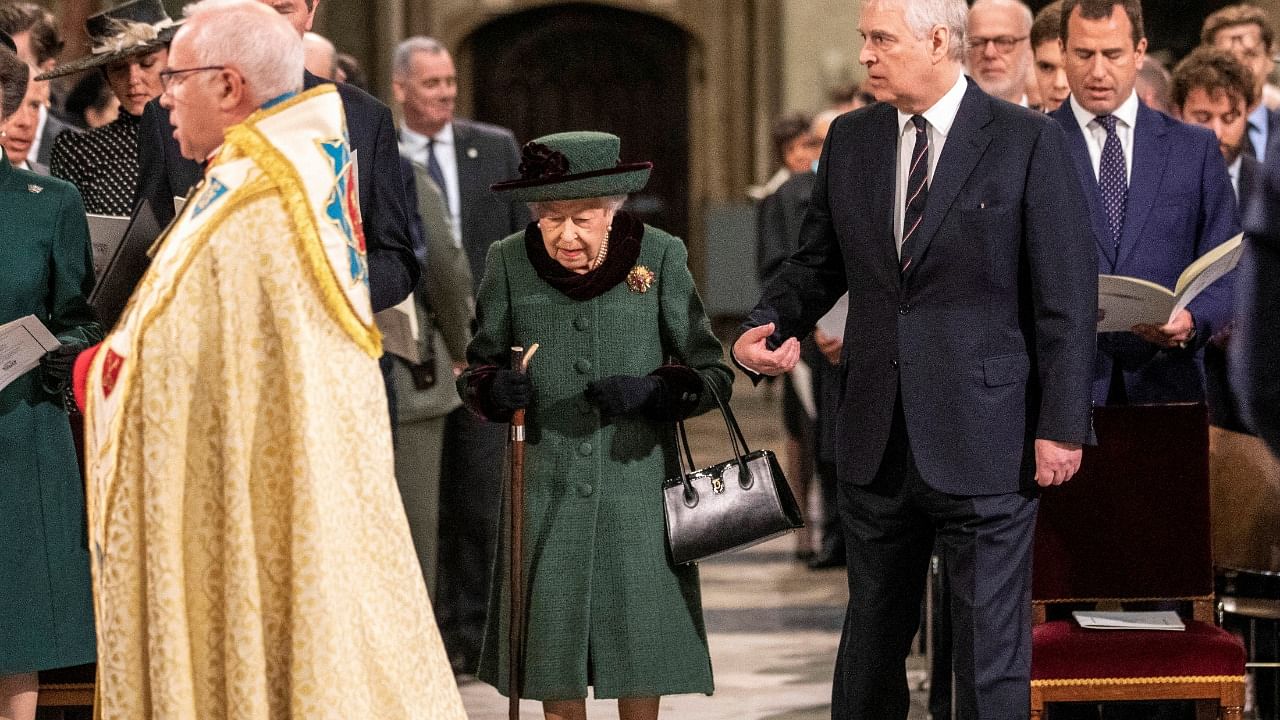 Britain's Queen Elizabeth, accompanied by Prince Andrew, Duke of York, attends a service of thanksgiving for late Prince Philip. Credit: Reuters Photo