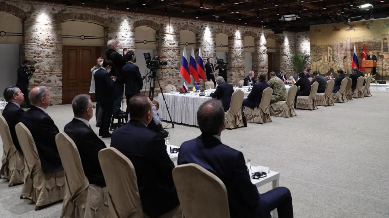 Turkish President Recep Tayyip Erdogan (R, back) addressing Russian and Ukrainian delegations at the opening ot their talks in Istanbul. Credit: AFP Photo