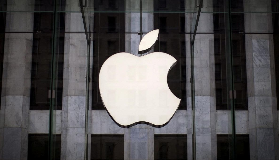  An Apple logo hangs above the entrance to the Apple store. Credit: REUTERS FILE PHOTO