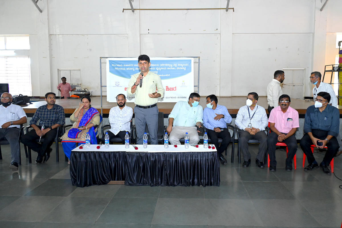 Mangaluru City Corporation Mayor Premananda Shetty addresses a gathering at a medical camp organised for pourakarmikas at Town Hall in Mangaluru on Wednesday.