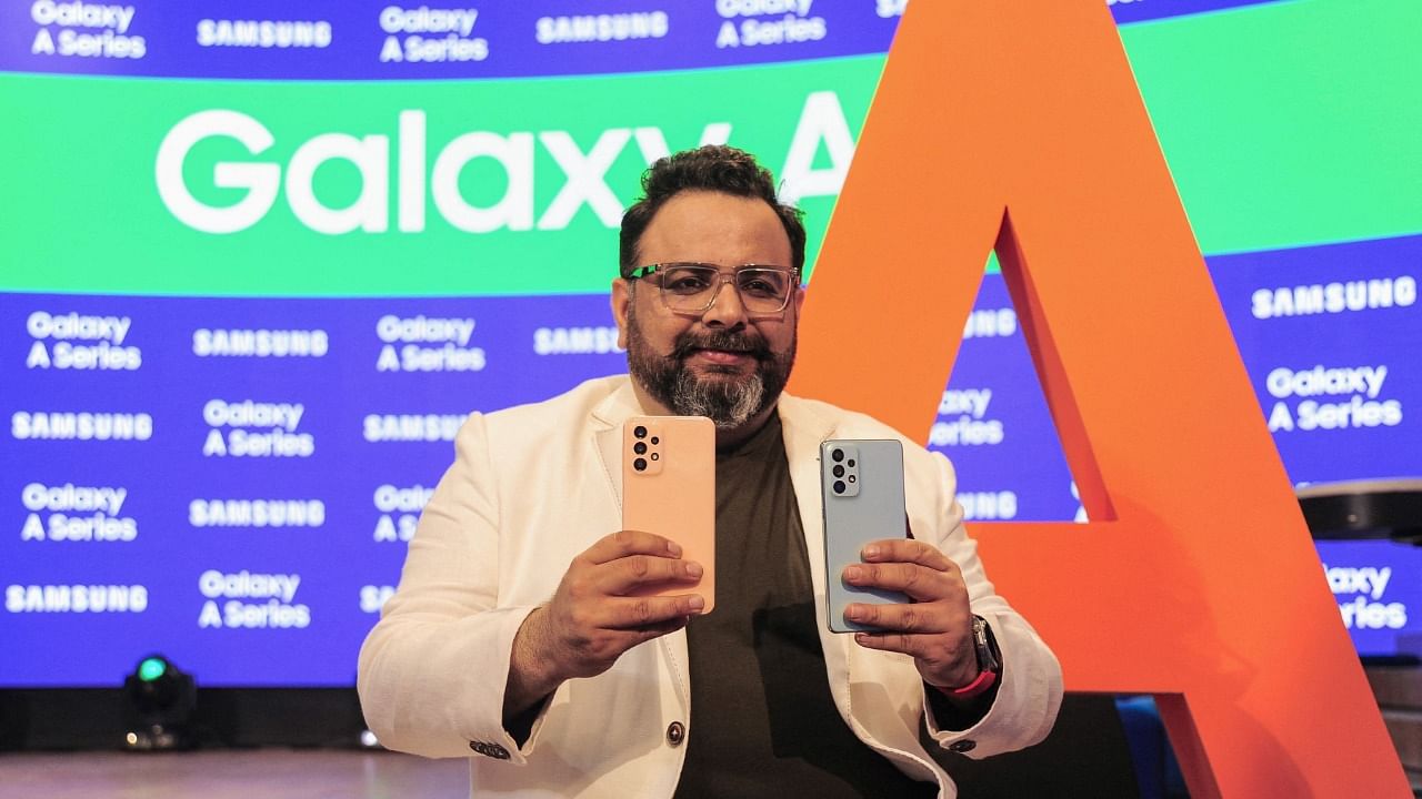 Senior Director and Marketing Head for Samsung India, Aditya Babbar poses for a photograph with Samsung’s new Galaxy A series smart phones during its launch event in Bengaluru. Credit: AFP Photo