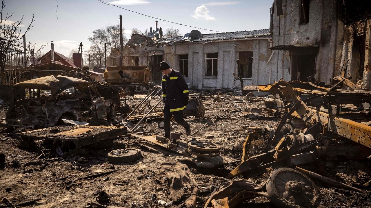  A Ukrainian firefighter walks in rubble in the northeastern city of Trostianets. Credit: AFP Photo