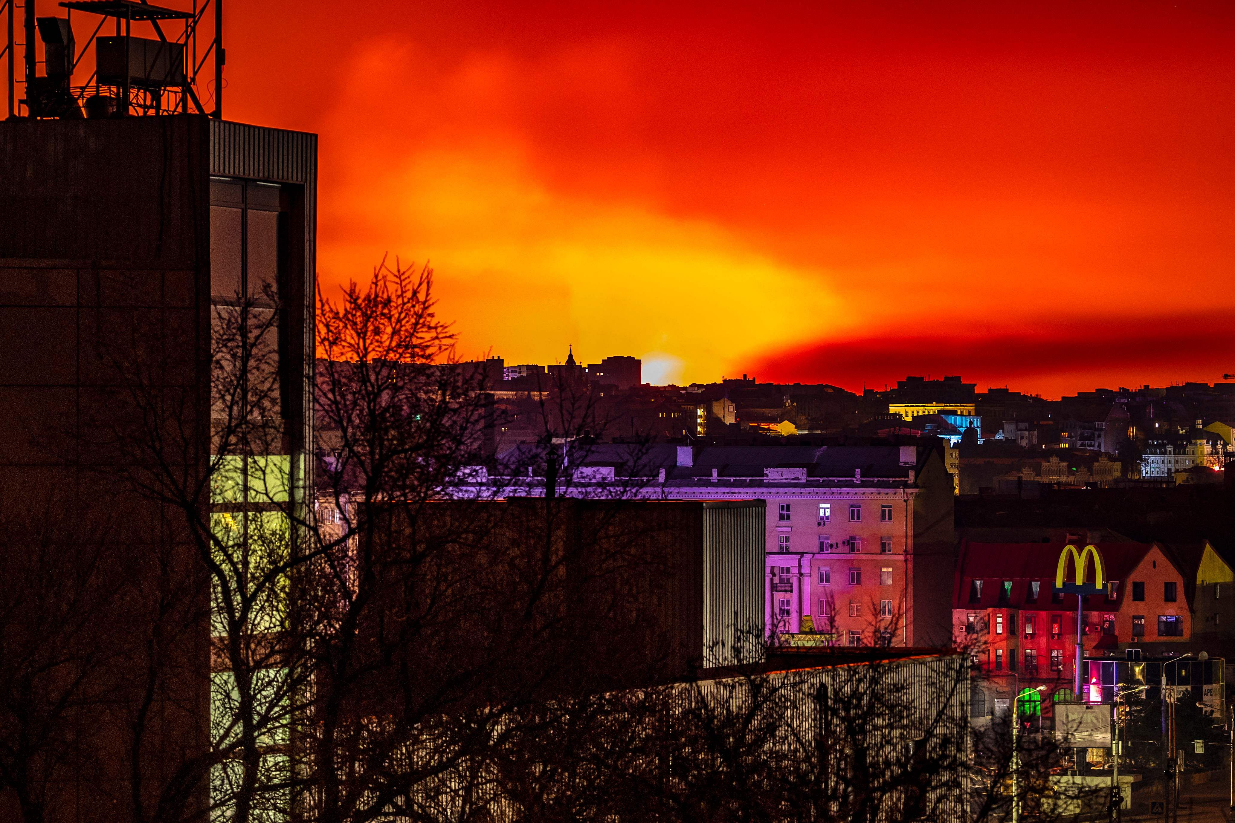 This general view taken on March 30, 2022 shows fire and smoke lighting up the night sky, east of Kharkiv. Credit: AFP Photo