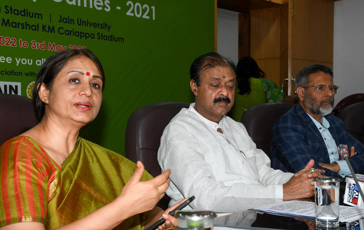Dr. SHALINI. RAJNEESH. I.A.S. Additional Chief Secretary,. Department of Youth. Empowerment and. Sports., Dr. KC Narayana Gowda, Minister of Youth Empowerment, Sports and Sericulture and Dr. Chenraj Roychand, Chancellor, JAIN (Deemed-to-be University) and Founder – Chairman, JAIN Group are seen during the press conference about announcement of The Khelo India University Games (KIUG) scheduled. Credit: DH Photo