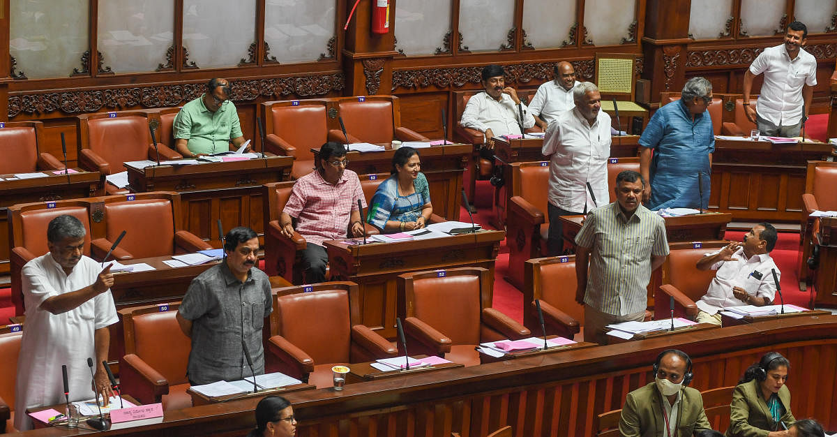 Opposition members B K Hariprasad, K Govindaraj and Marithibbegowda raise the KIADB land allotment issue in the Legislative Council during the Karnataka legislature session in Bengaluru on March 30, 2022. DH PHOTO/S K DINESH