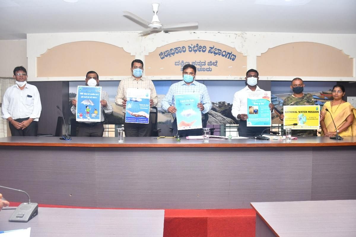 Deputy Commissioner Dr Rajendra K V releases posters on water conservation in Mangaluru.