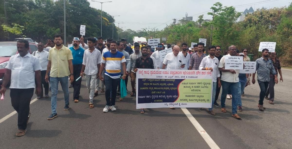 Members of various organisations take out a foot march from Malpe to Manipal.