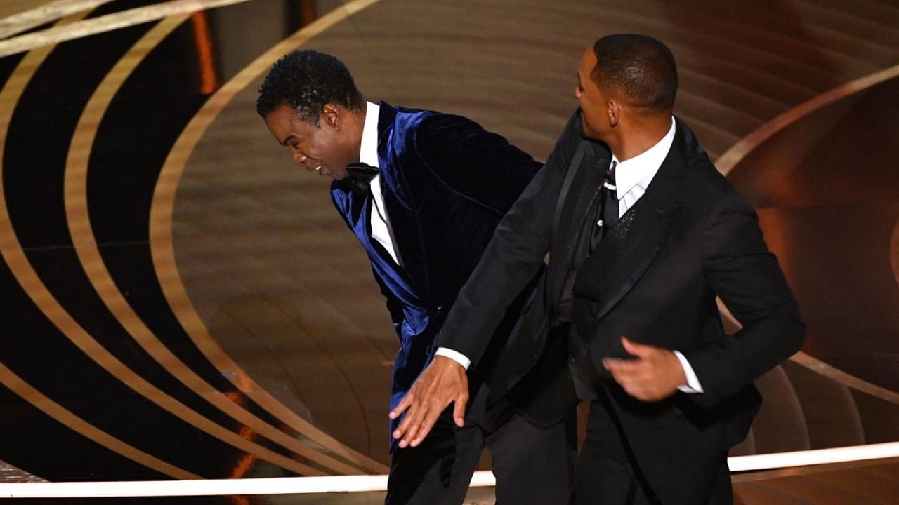 In this file photo taken on March 27, 2022 US actor Will Smith (R) slaps US actor Chris Rock onstage during the 94th Oscars at the Dolby Theatre in Hollywood. Credit: AFP Photo