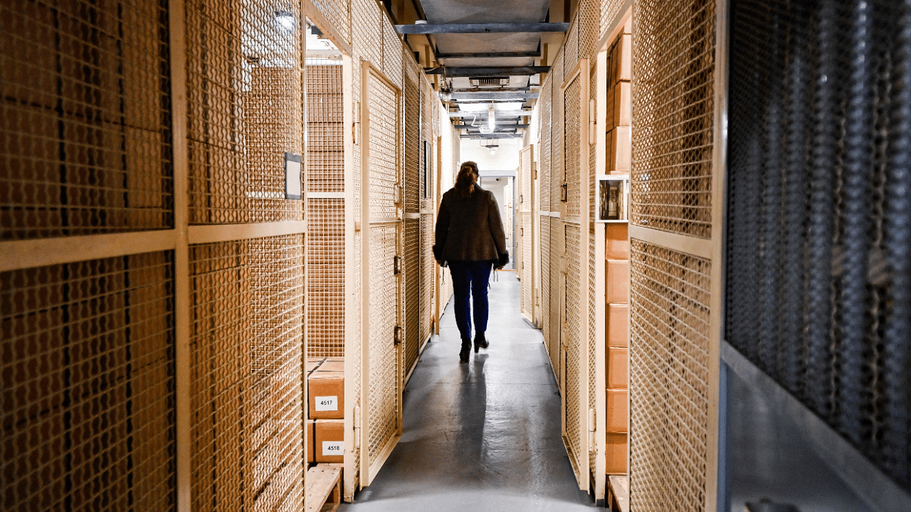 Petra Reuter, owner of the Bundesbank Bunker Museum, walks past storage rooms for the substitute currency in the former vault of the bunker museum in Cochem. Credit: AFP Photo