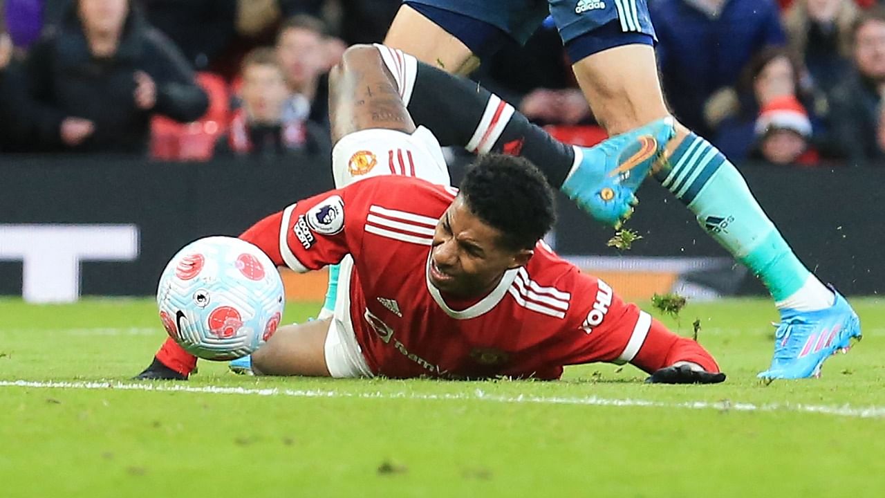 Manchester United's English striker Marcus Rashford reacts after being tackled during the English Premier League football match between Manchester United and Leicester City at Old Trafford in Manchester. Credit: AFP Photo